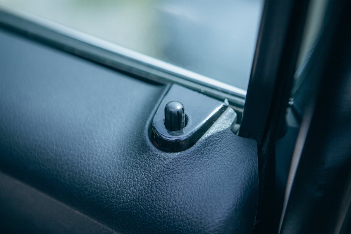 Close-up of a vehicle door lock button